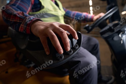 Preview: Close-up photo of male driving car at work