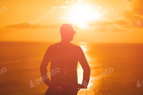 Preview: Man With Nice Tropical Summertime Sunset On The Island Above The Ocean.