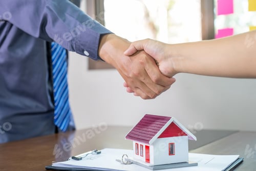 Preview: Real estate agents and buyers handshake after signing a business contract, renting, buying, mortgage