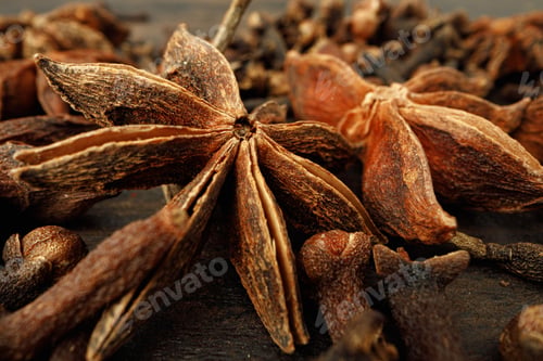 Preview: Macro photo of anise stars on wooden background