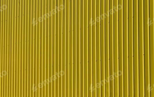 Preview: Bright texture of vertical metal siding painted yellow.