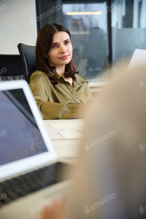 Preview: Business women leading meeting focused on clothing design