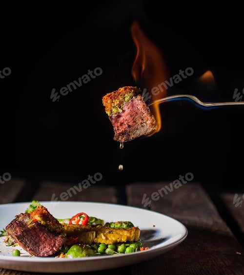 Preview: Spicy meat dinner with fire in dark style
