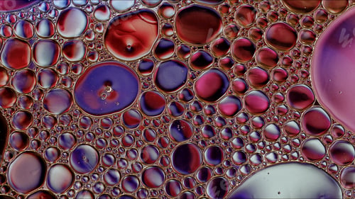 Preview: Abstract Colorful Food Oil Drops Bubbles and spheres Flowing on Water Surface