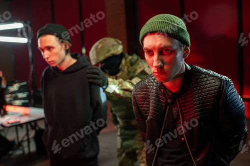 Preview: Two hackers in black jackets standing in front of camera