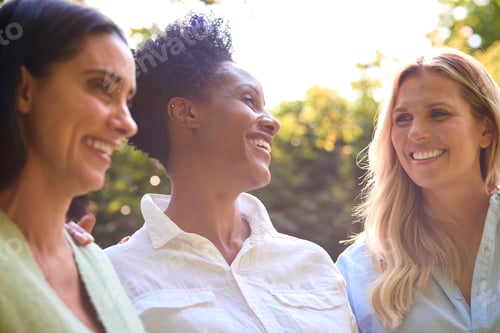 Preview: Three Smiling Mature Female Friends Outdoors Spending Time In Countryside Together