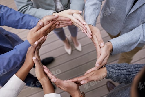 Preview: Shot of a group of unrecognizable businesspeople forming a circle with their hands outside