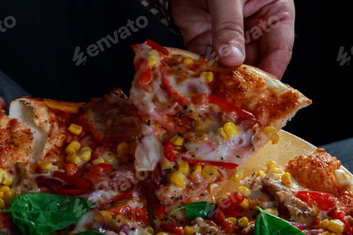 Preview: Hand taking slice of delicious pizza, person enjoying pizza in restaurant