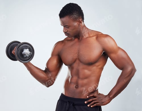 Preview: One young African American fitness model posing topless while exercising with dumbbells .Confident