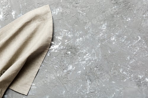 Preview: top view with gray kitchen napkin isolated on table background