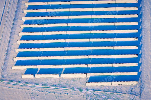 Preview: Snowy solar panels in winter. Pure energy in winter