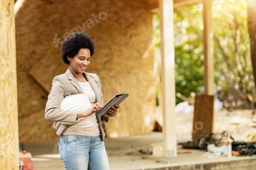 Preview: Black Woman Architect Using A Digital Tablet At Construction Site