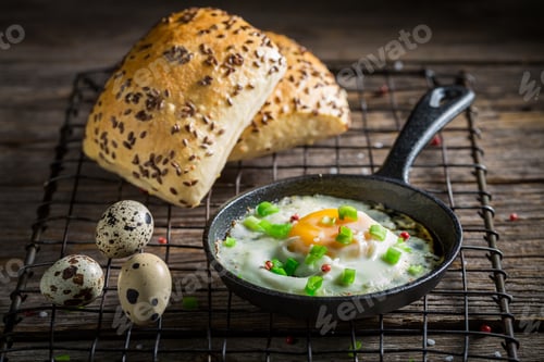 Preview: Tasty fried eggs with bun and chive