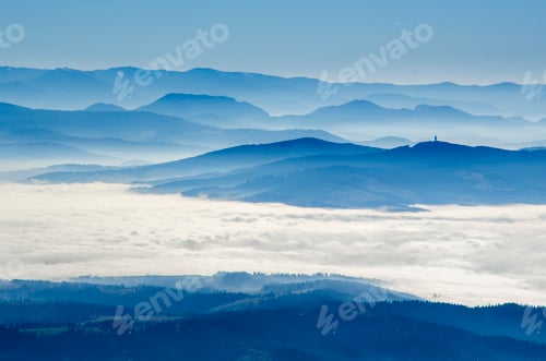 Preview: Scenic Mountain Range Above Clouds, Hazy Blue