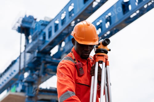 Preview: Surveyors and engineers use a theodolite and plans to measure and check construction.