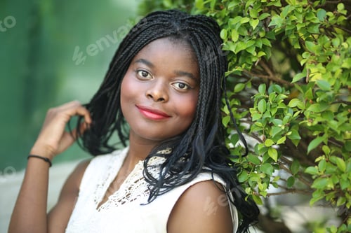 Preview: Portrait of young afro black girl posing outdoor.