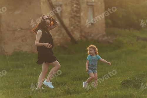 Preview: active family walks in the rays of the setting sun, lifestyle