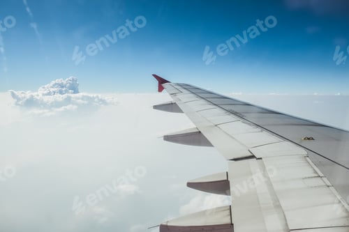 Preview: View of beautiful cloud and wing of airplane from window