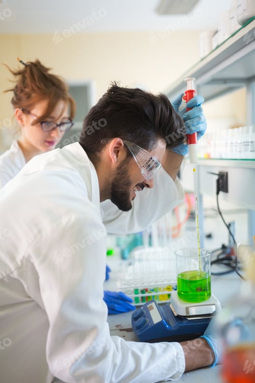 Preview: Group of chemistry students working in laboratory