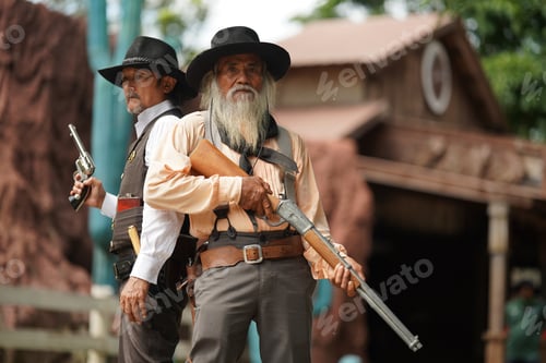 Preview: Brutal cowboy with revolver, gunfight on ranch, rural background.