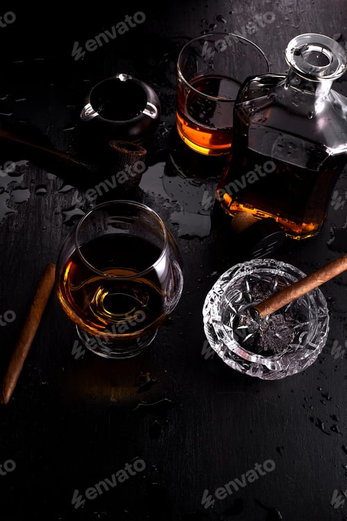 Preview: Glass of whiskey with smoking cigar.