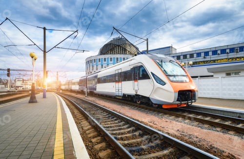 Preview: High speed train on the railway station at sunset