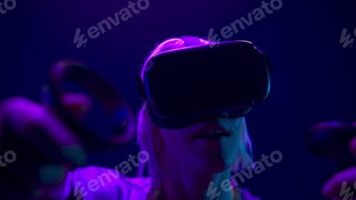 Preview: VR headset man playing 3D videogame closeup. Metaverse technology concept