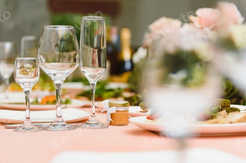 Preview: beautifully laid tables with glasses and appliances at morning in restaurant.