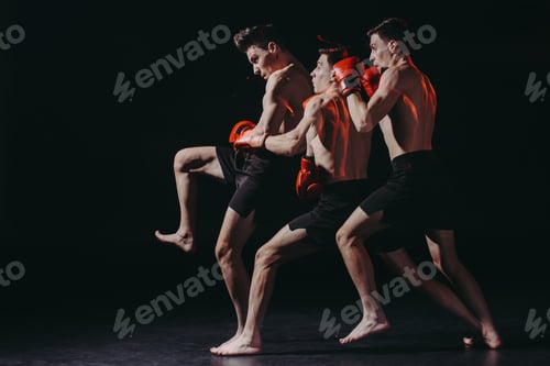 Preview: sequence shot of sporty muscular boxer in boxing gloves doing kick