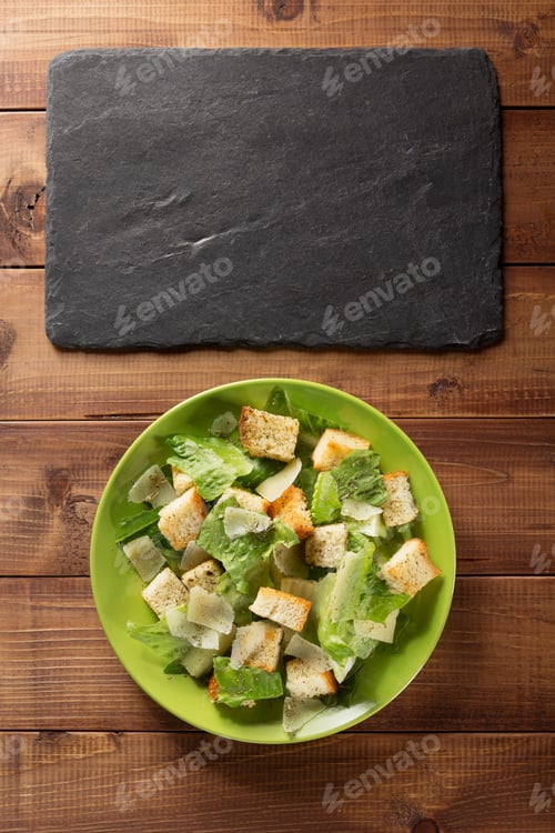 Preview: Fresh Caesar Salad with Croutons on Wooden Table