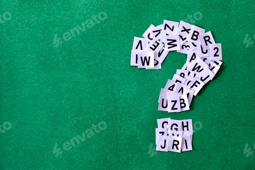 Preview: Question mark on green background with copy space made of paper