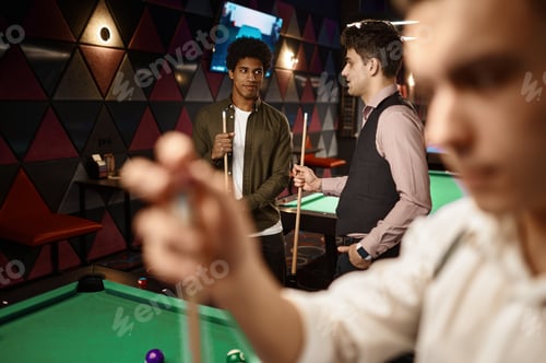Preview: Young people friends or student playing billiards