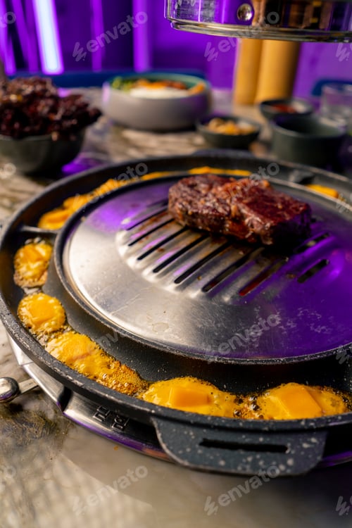 Preview: close up of delicious appetizing juicy piece of grilled meat with cheese being fried in restaurant