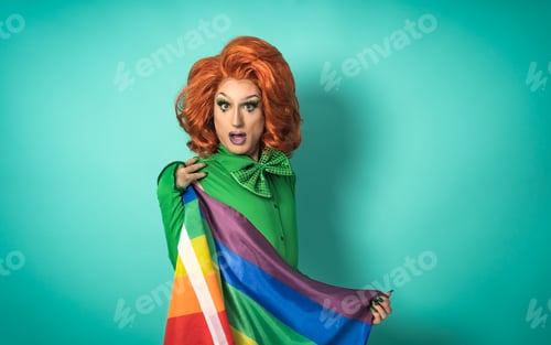 Preview: Drag queen celebrating gay pride holding rainbow flag - LGBTQ social community concept