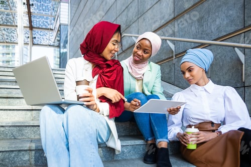 Preview: Beautiful muslim girl wearing hijab bonding outdoors