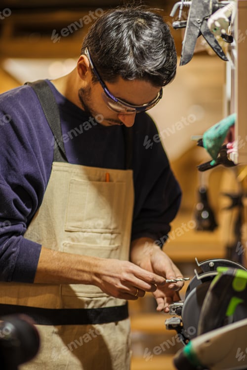 Preview: young carpenter man at work