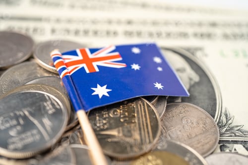 Preview: Stack of coins with Australia flag on white background.