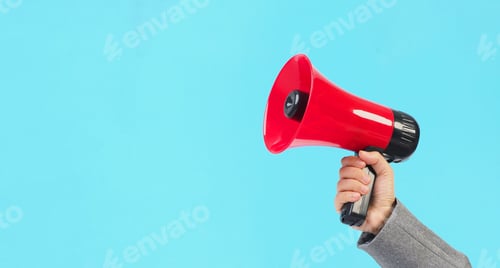 Preview: Hand is hold red megaphone and wear grey suit on blue background