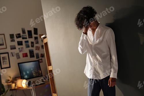 Preview: Sick teenage guy touching his head