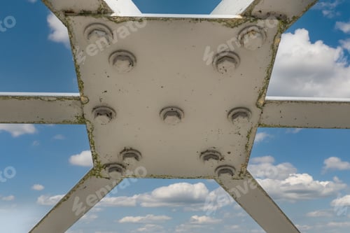 Preview: Bolts and nuts on metal plates of steel structure of heavy duty straight crossbar of frame