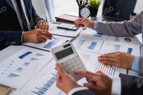 Preview: Business Professionals Analyzing Data Charts in an Office