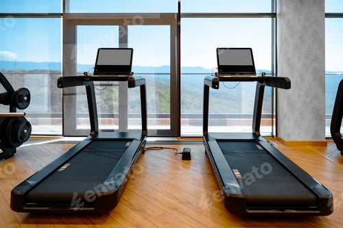 Preview: Studio shot of a professional treadmill in modern gym