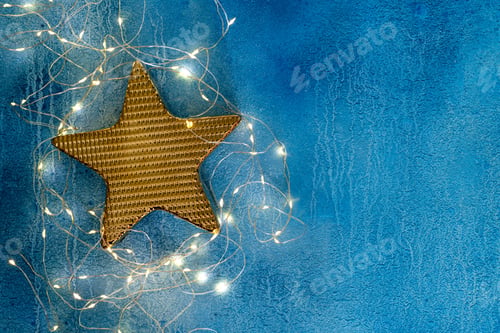 Preview: Christmas holidays composition with festive decoration golden star and garland illumination