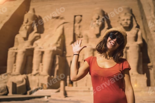 Preview: A young tourist in red dress at the Abu Simbel Temple in southern Egypt in Nubia