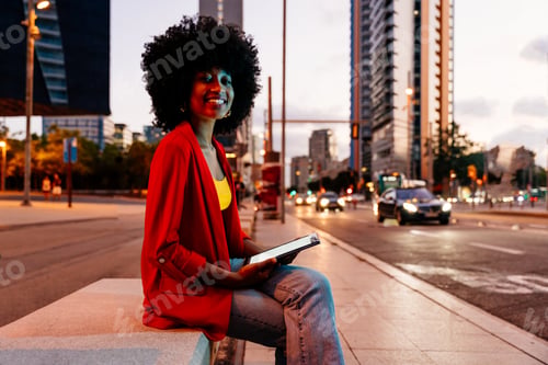Preview: Beautiful young black woman outdoors in the city