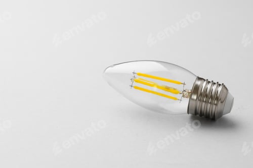 Preview: Light bulb on light grey paper background