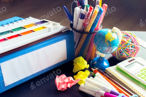Preview: Desk of an artist with lots of stationery objects