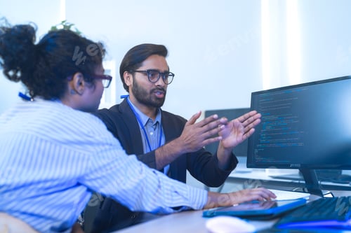 Preview: Diverse software developers in a lively discussion about a project.