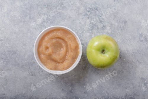 Preview: Bowls with healthy baby food on color background. Purees, made of fresh organic apple flay lay