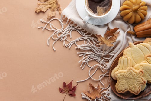 Preview: Cup of coffee, cookies on tray, yellow leaves.